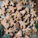 pile of Easy one-bowl gingerbread cookies in gingerbread man cut outs