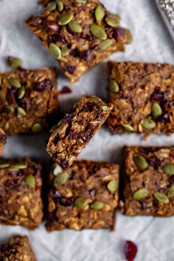Easy One Bowl Vegan & Gluten-Free Pumpkin Oatmeal Bars on parchment paper