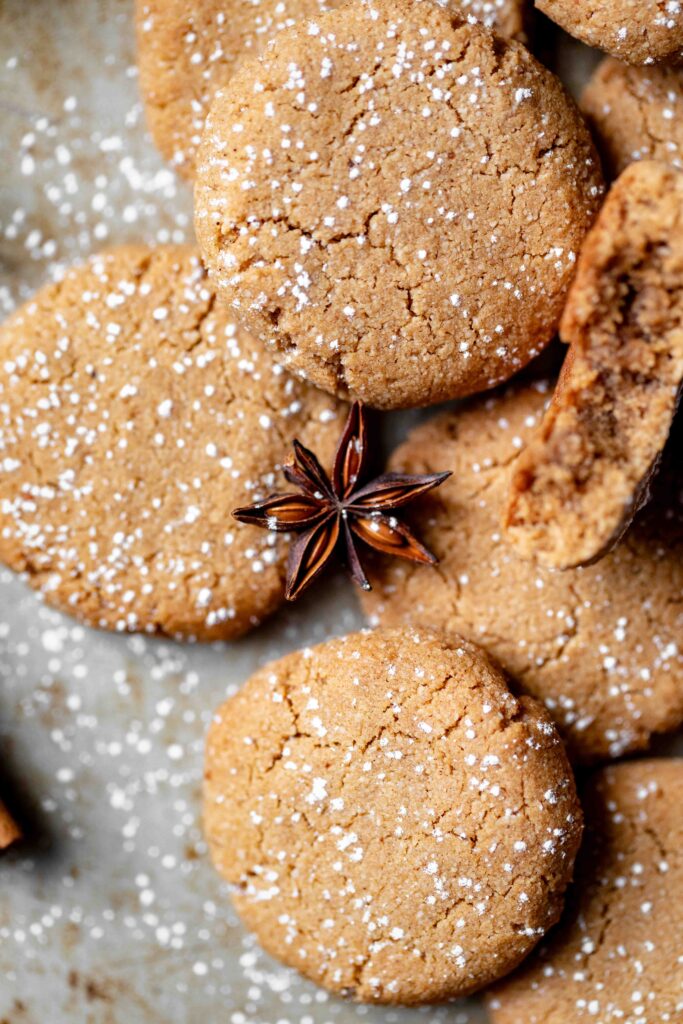 fresh baked one bowl gingerbread cookies with powdered sugar and star anise