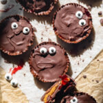 halloween themed monster peanut butter cups with jam filling and candy eyes