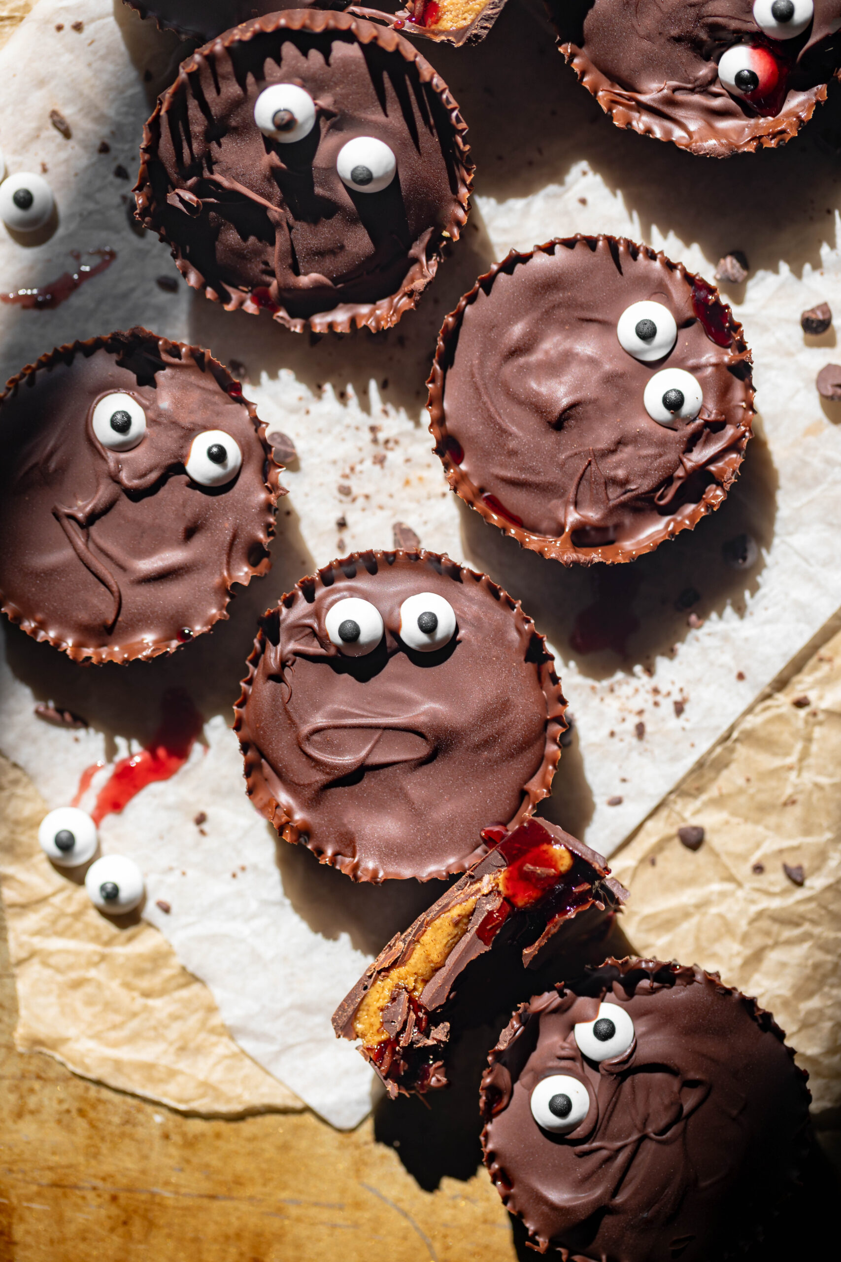 halloween themed monster peanut butter cups with jam filling and candy eyes